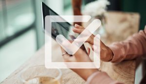 Concept of voting showing a mobile device with a checkmark.